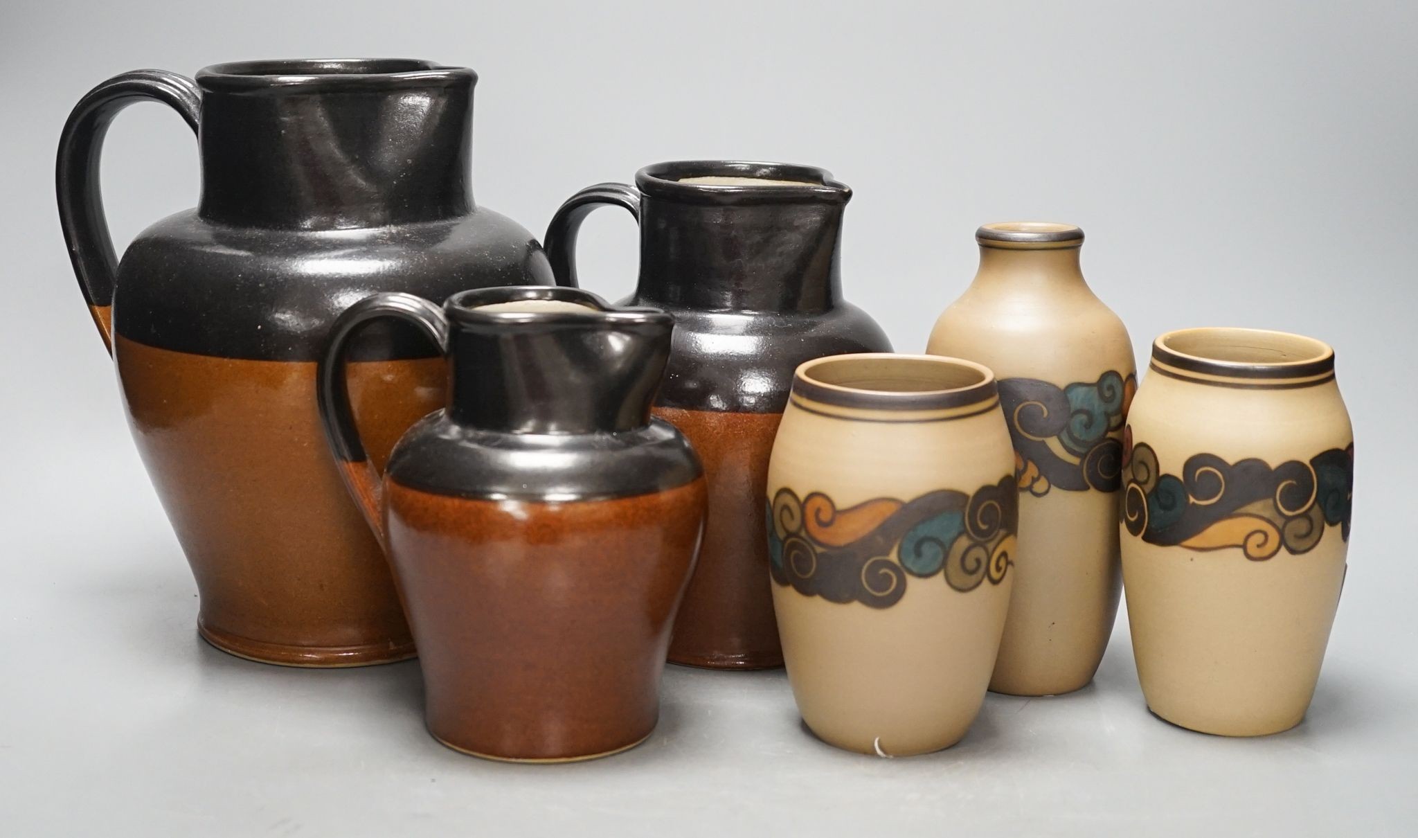 A graduated set of three Bourne Denby stoneware jugs and three 1930's stoneware vases, by Bornholm, Denmark (6)